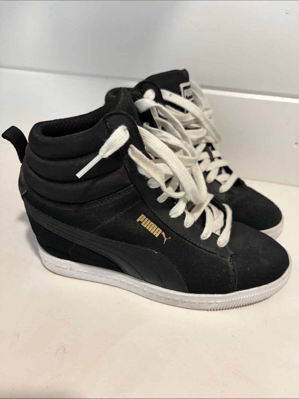 Puma Black High-Top Sneakers with White Laces and Gold Logo